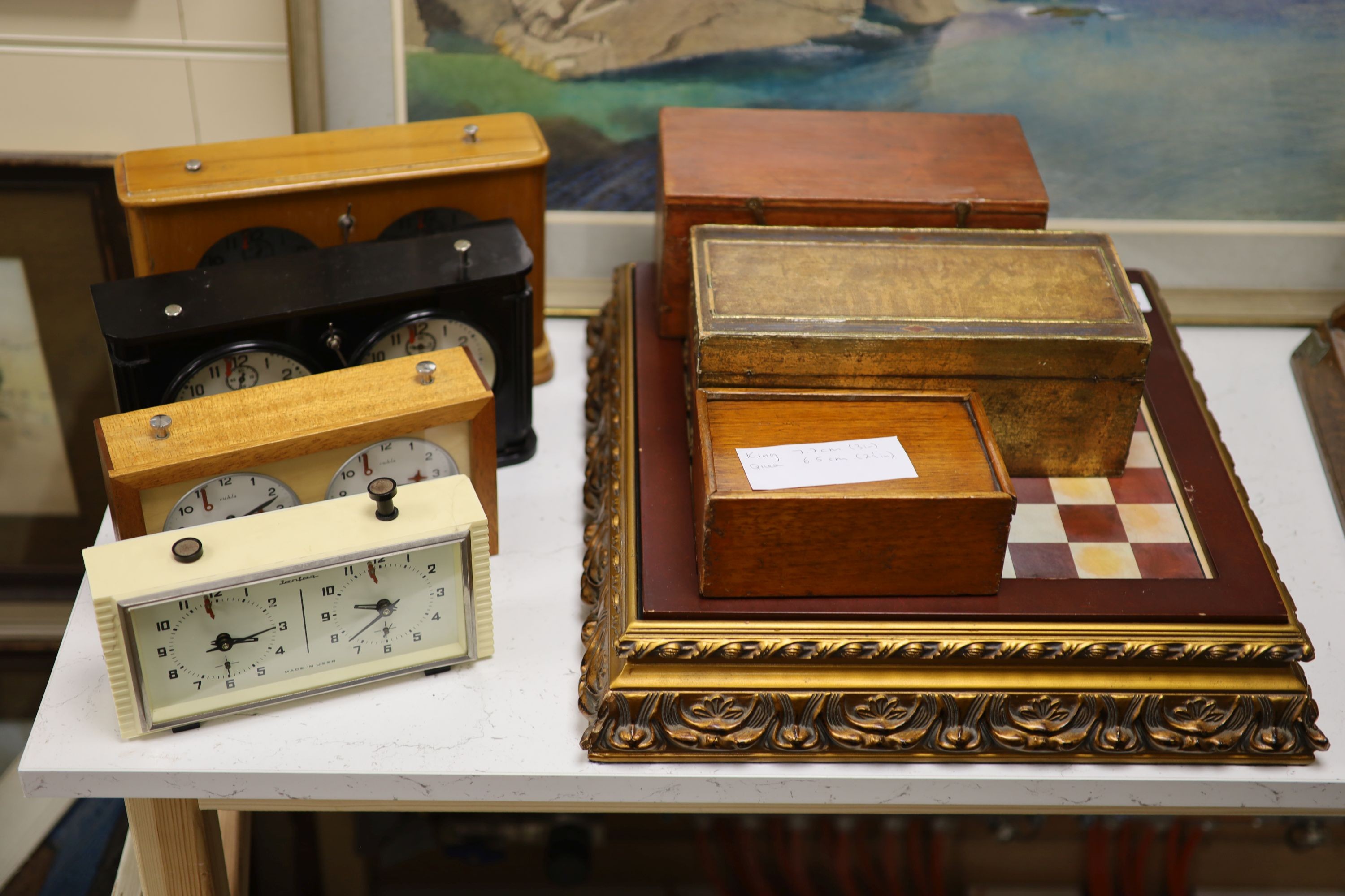 Four chess sets and four chess clocks